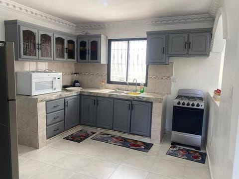 Kitchen or kitchenette, microwave, oven, stove