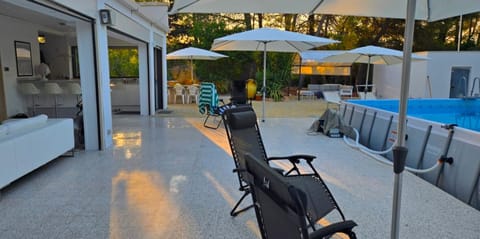 Living room, Seating area, Pool view