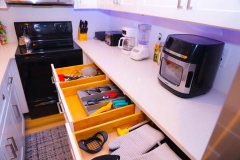 Kitchen or kitchenette, dishwasher, stove, toaster