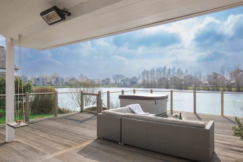 Property building, Patio, Natural landscape, Balcony/Terrace, Seating area, Lake view