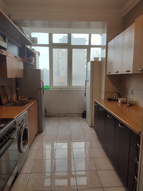 Kitchen or kitchenette, stove, washing machine