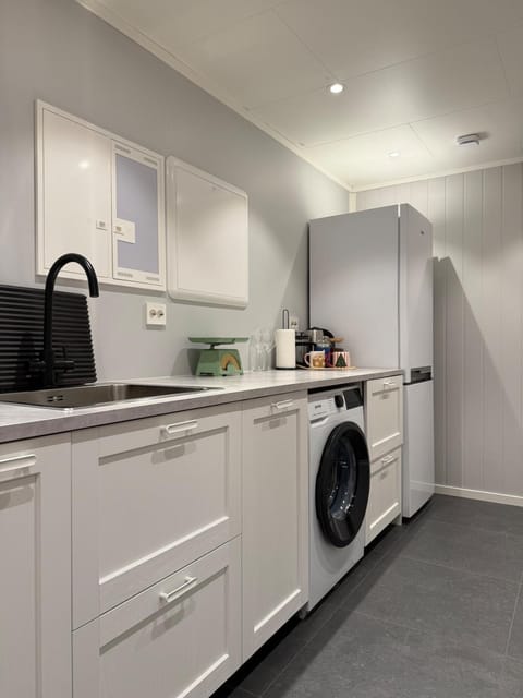 Kitchen or kitchenette, dishwasher, stove, washing machine