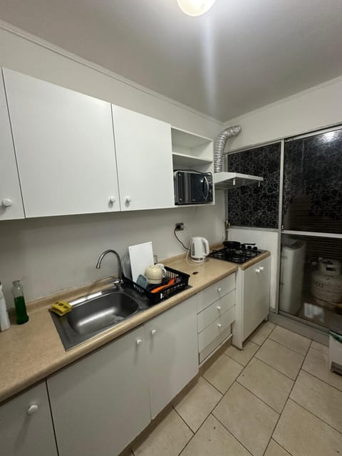 Kitchen or kitchenette, oven, stove