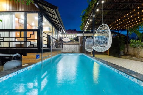 Property building, Patio, Night, Pool view, Swimming pool, sunbed