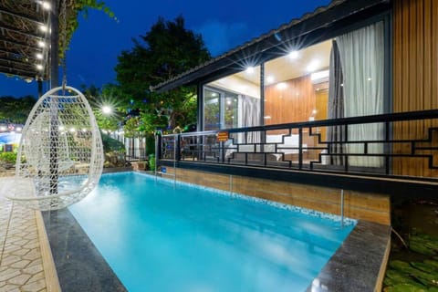 Property building, Patio, Night, Pool view, Swimming pool