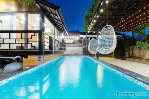 Property building, Patio, Night, Pool view, Swimming pool, sunbed