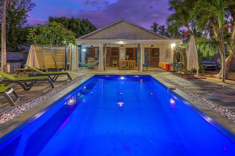 Property building, Patio, Night, Pool view, Swimming pool, sunbed