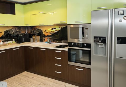 Kitchen or kitchenette, dishwasher, oven, stove