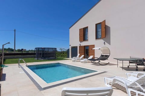 Property building, Patio, Day, Table tennis, Pool view, Swimming pool, sunbed