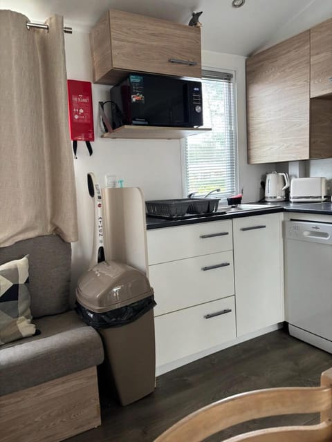 Kitchen or kitchenette, dishwasher, oven, stove, toaster