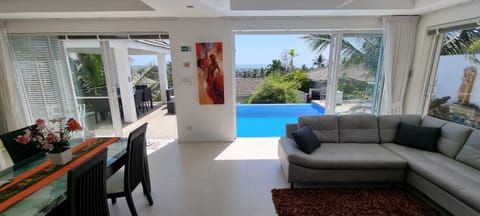 Balcony/Terrace, Living room, Seating area, Pool view