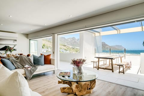 View (from property/room), Balcony/Terrace, Living room, Seating area, Dining area, Mountain view, Sea view