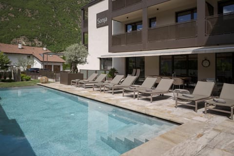 Property building, Patio, Natural landscape, Children play ground, Garden, Mountain view, Pool view, Swimming pool, sunbed