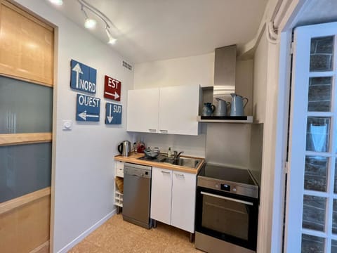 Kitchen or kitchenette, dishwasher, oven, stove, toaster