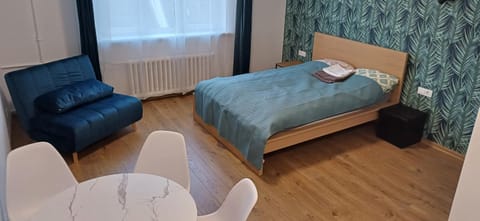 Bed, Living room, Seating area, Bedroom