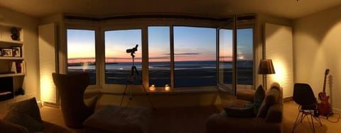 Natural landscape, Library, Living room, Seating area, Sea view, Sunset