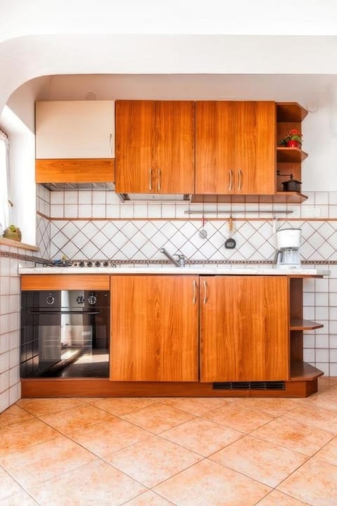 Kitchen or kitchenette, stove, kitchen