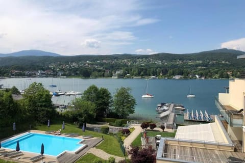 Property building, Nearby landmark, Day, Natural landscape, Lake view, Pool view, Swimming pool, sunbed