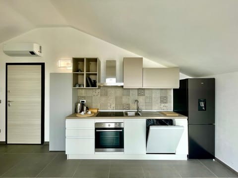 Kitchen or kitchenette, dishwasher, oven, stove