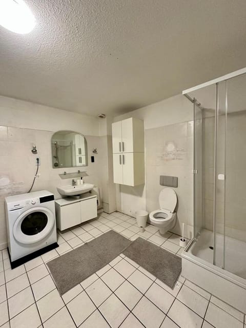 Shower, Toilet, Bathroom, towels, washing machine, dryer