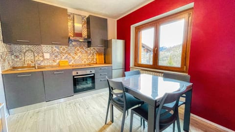 Kitchen or kitchenette, dishwasher, oven, stove