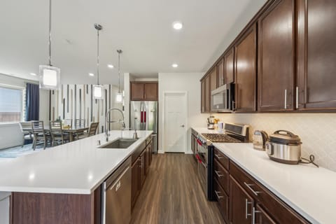 Kitchen or kitchenette, dishwasher, oven, stove