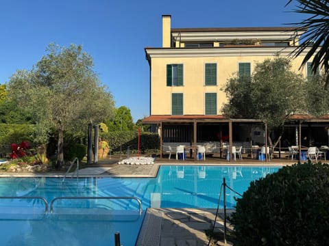 Property building, Pool view, Swimming pool, sunbed