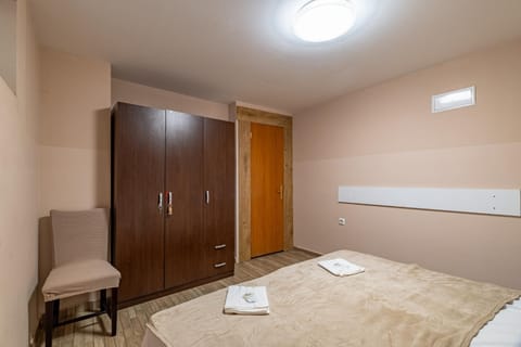 Bed, Photo of the whole room, Seating area, Bedroom, towels, wardrobe