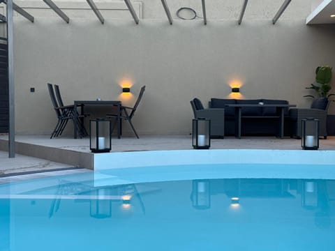 Patio, Living room, Seating area, Pool view, Swimming pool, sunbed