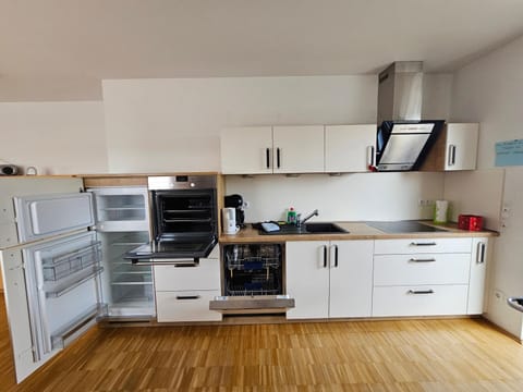 Kitchen or kitchenette, dishwasher, oven, stove