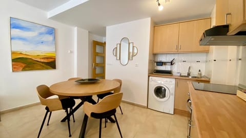 Kitchen or kitchenette, Dining area, oven, stove, toaster, washing machine