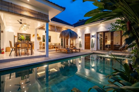 Property building, Patio, Night, Pool view, Swimming pool, sunbed