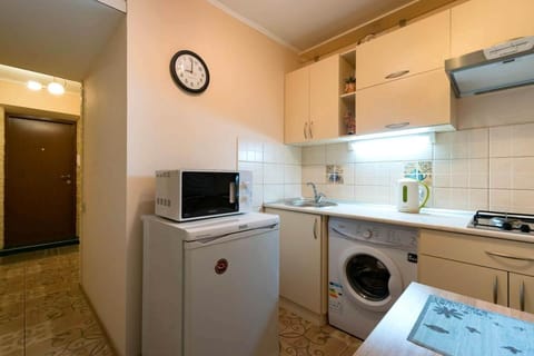 Kitchen or kitchenette, stove, washing machine