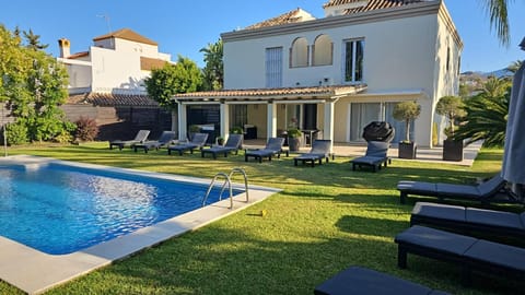 Property building, Patio, Spring, Day, Garden, Seating area, Garden view, Pool view, Swimming pool, sunbed