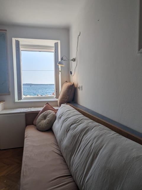 Bed, Natural landscape, Living room, Seating area, Sea view