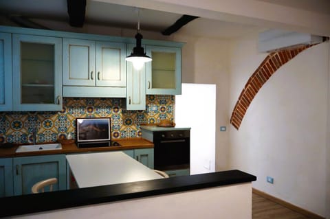 Kitchen or kitchenette, dishwasher, oven, stove