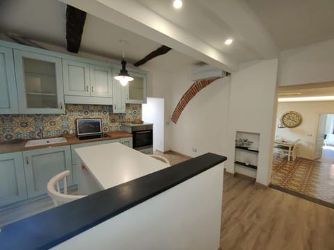 Kitchen or kitchenette, dishwasher, oven, stove