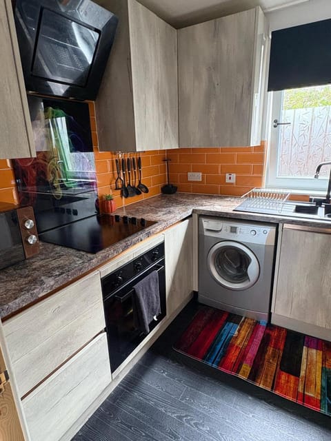 Kitchen or kitchenette, oven, stove, toaster, washing machine