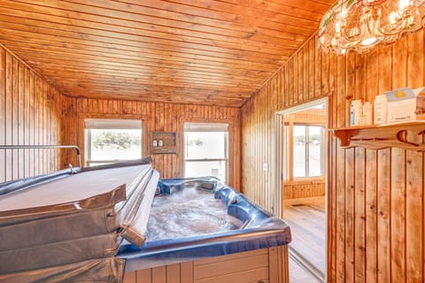 Private Indoor Hot Tub Fish and Boat on Sylvan Lake House in Rome City