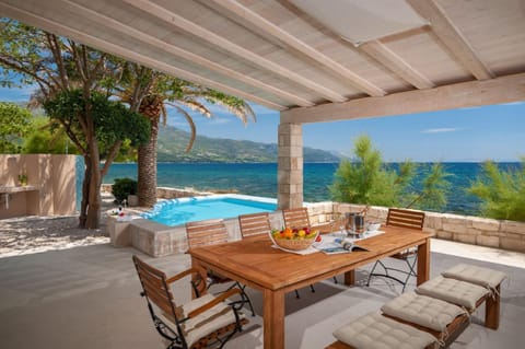 Property building, Patio, Day, Natural landscape, View (from property/room), Balcony/Terrace, Dining area, Beach, Mountain view, Pool view, Sea view, Sea view, Swimming pool, sunbed