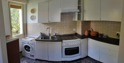 Kitchen or kitchenette, washing machine