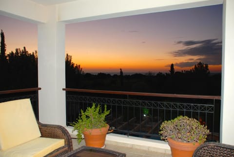 Balcony/Terrace, Seating area, Garden view, Landmark view, Pool view, Sea view, Sunset