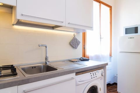 Kitchen or kitchenette, washing machine
