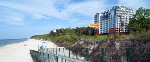 Property building, Off site, Day, Neighbourhood, Natural landscape, Summer, Garden, View (from property/room), Balcony/Terrace, Floor plan, Beach, Beach, Text overlay, Landmark view, Sea view, Sea view