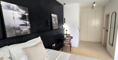 Bed, Seating area, wardrobe