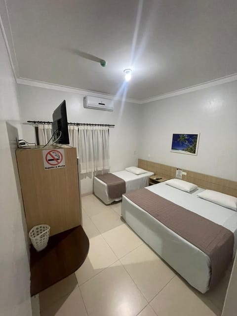 Bed, TV and multimedia, Bedroom, fireplace, hair dresser, air conditioner