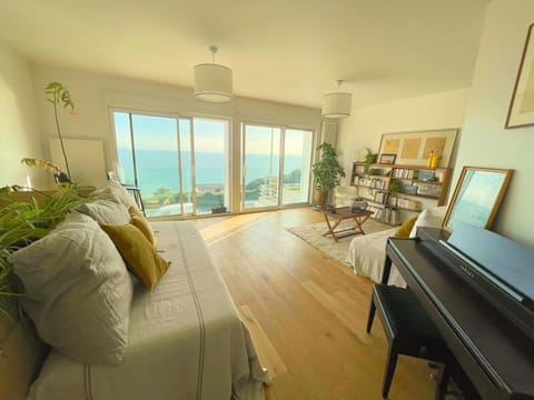 People, Natural landscape, Garden, Library, View (from property/room), Living room, Decorative detail, Seating area, Dining area, Evening entertainment, Guests, Garden view, Landmark view, Sea view, children, young children, older children, group of guests, Family, furniture, internet, towels, washing machine, kitchen