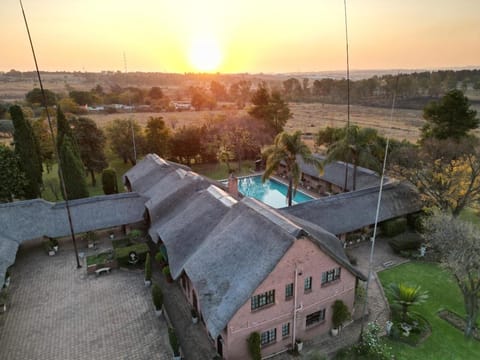 Property building, Day, Natural landscape, Bird's eye view, Pool view, Swimming pool, Sunset