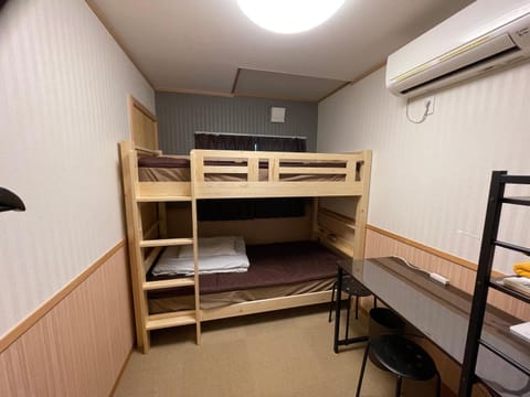 Photo of the whole room, bunk bed, air conditioner