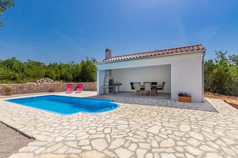 Patio, BBQ facilities, Seating area, Swimming pool, sunbed